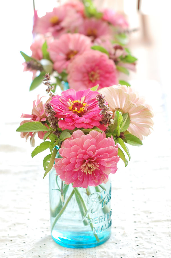 Zinnias and Basil in Blue Bal Jars The Prudent Homemaker