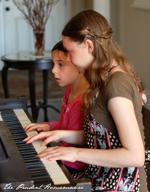 Libby and Winter at the piano The Prudent Homemaker