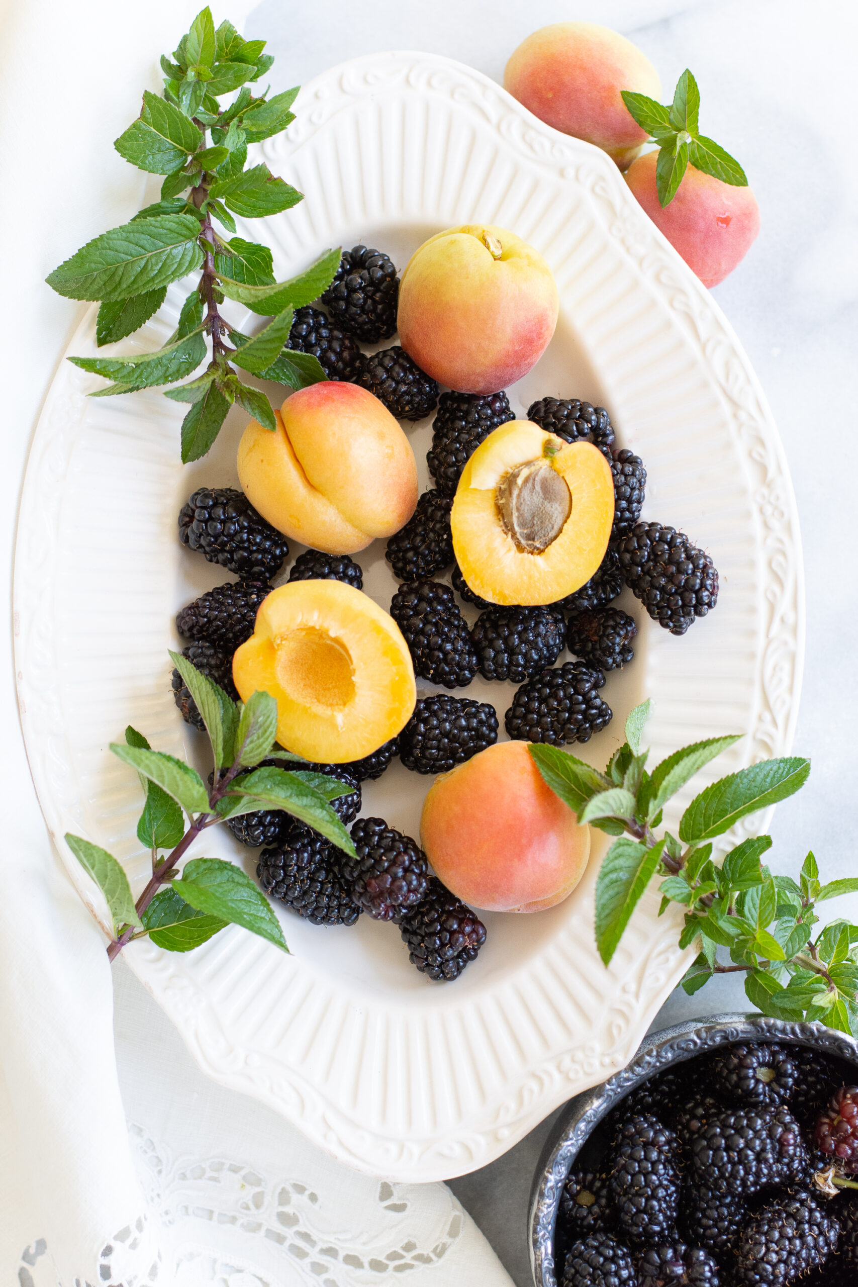 https://theprudenthomemaker.com/wp-content/uploads/2022/05/Blackberries-and-Apricots-in-May-2-The-Prudent-Homemaker-scaled.jpg